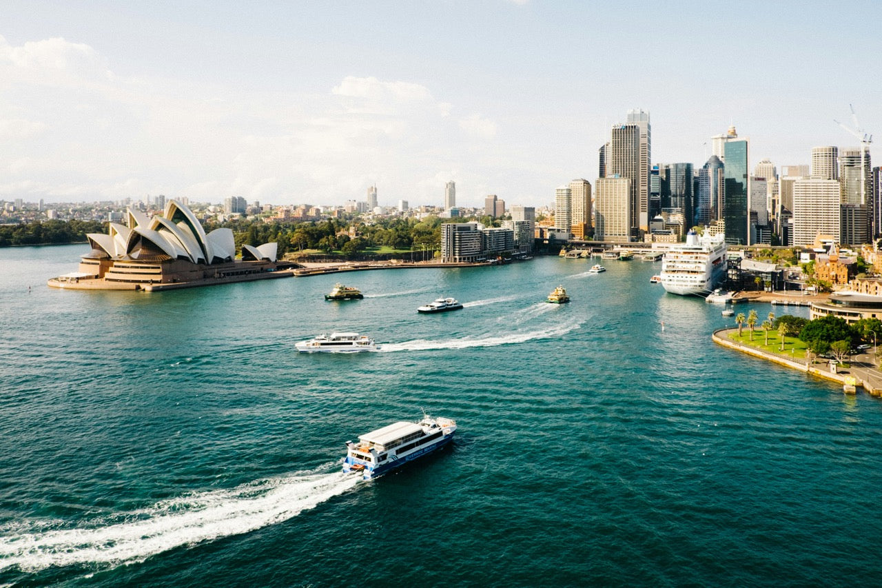 A scenic view of Sydney Harbour featuring the iconic Sydney Opera House